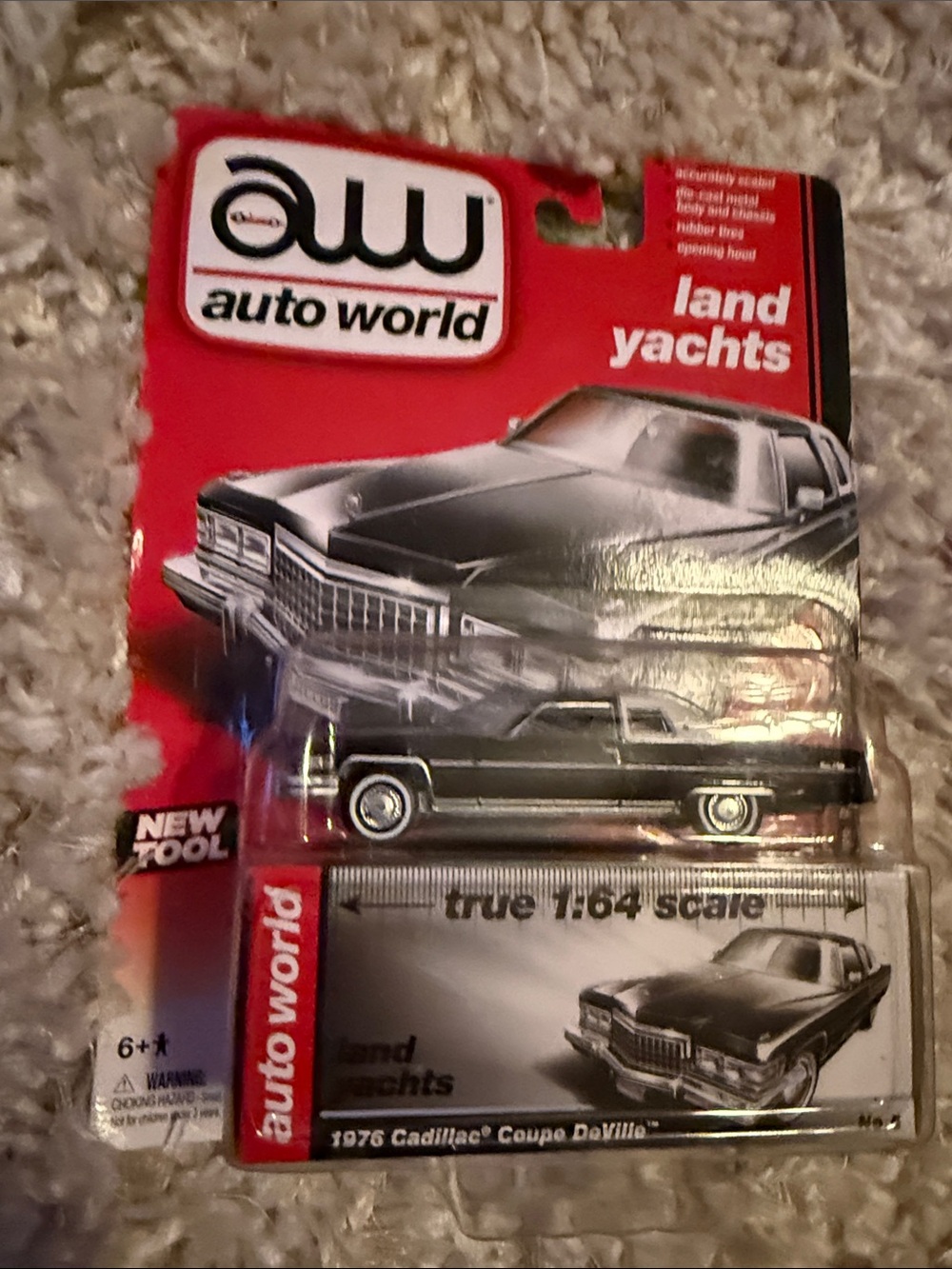 NEW UH Auto World Luxury Cruisers 1976 CADDILLAC COUPE DeVILLE REL4 Sable Black